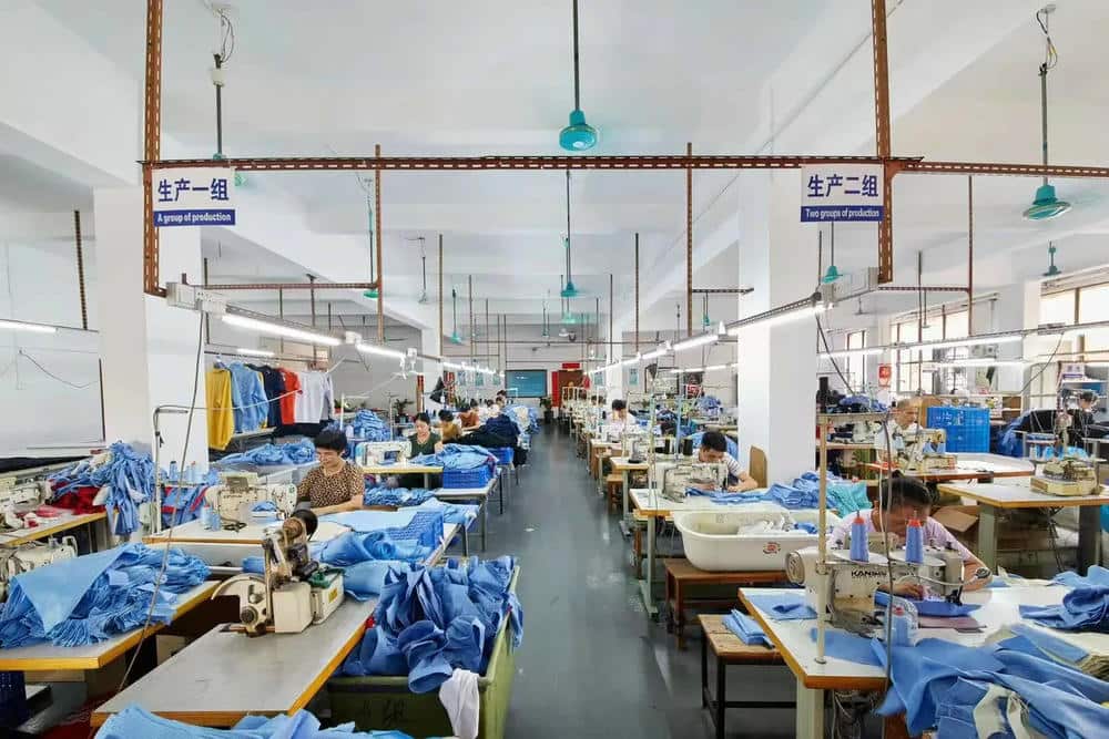 factory sewing jacket on production line